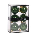 Six glossy green glass Christmas ornaments 7 cm diameter, inside a clear rectangular display box with a black frame and a black band label reading 'Goodwill M&G Co. Glass Baubles'.