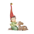 A Christmas ornament figurine depicting a kneeling helper pixie in a red pointed hat and green outfit next to a brown spotted deer Bambi, with a small gold bell at the top of the hat, shown on a plain white background - 14.5 cm