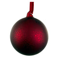 A round red Christmas ornament bauble with a textured, crackled antique glass finish and a matching velvet red hanging ribbon, shown against a plain white background.