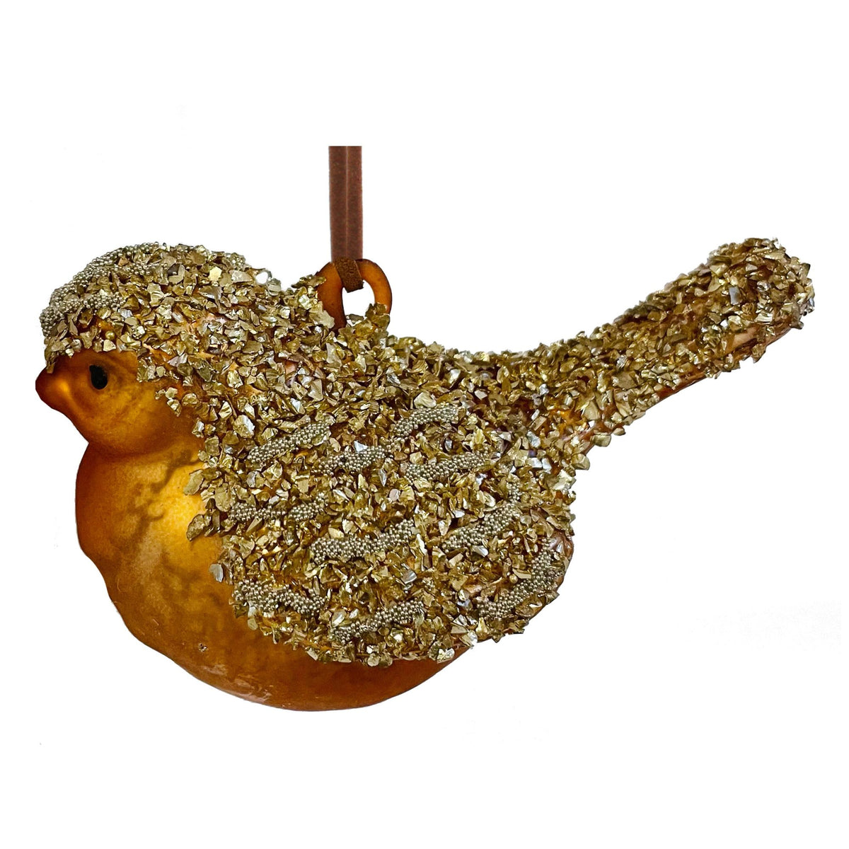 A decorative glass bird ornament with a glossy amber-brown body and wings covered in shimmering gold sequins and rhinestones, hanging from a brown ribbon on a white background.