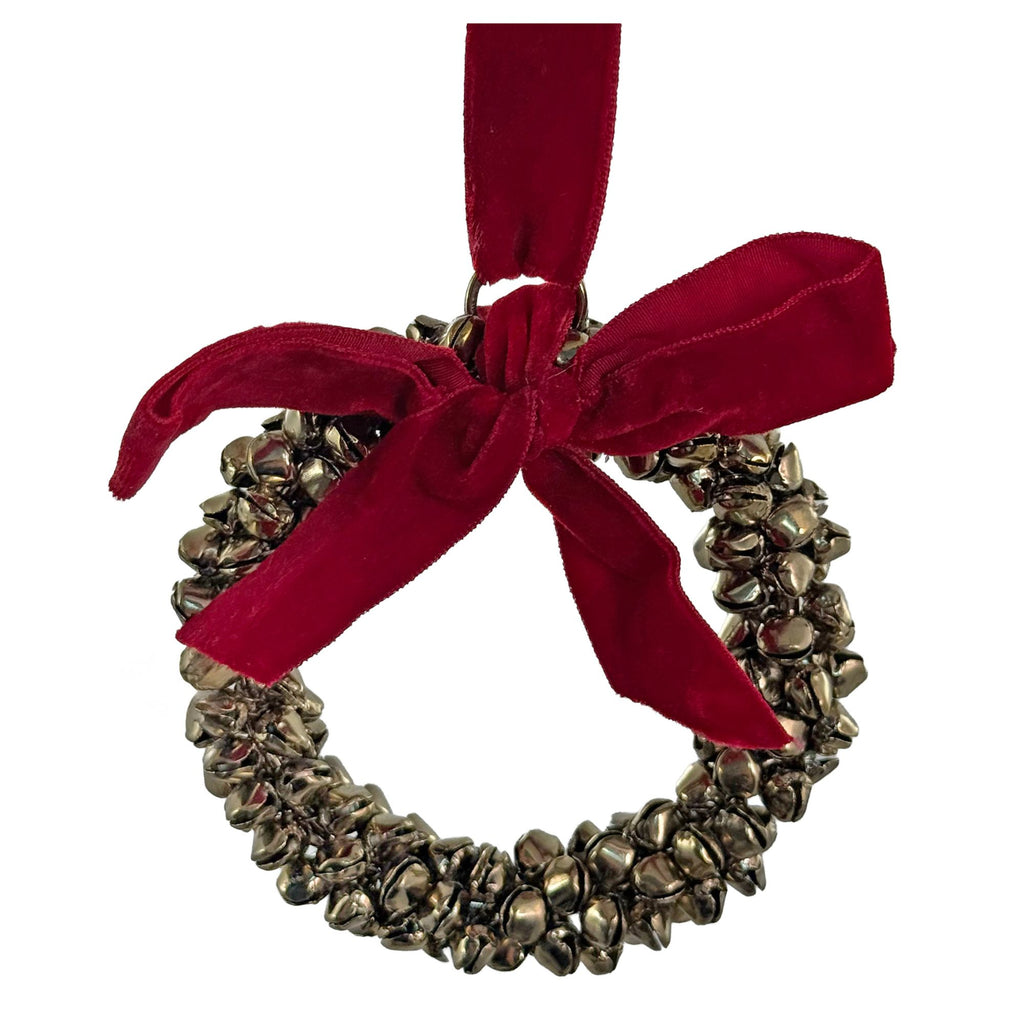 Aged metallic iron bell ring Christmas ornament with a classic red velvet bow