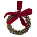 Aged metallic iron bell ring Christmas ornament with a classic red velvet bow