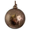 A metallic bronze Christmas ornament with a textured, etched leaf pattern and a hanging loop at the top, shown against a plain white background.