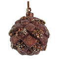 A textured, glittery brown Christmas ornament shaped like a pinecone or acorn, adorned with metallic gold, bronze, and silver sequins, hanging from a brown ribbon against a white background.