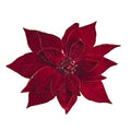 A deep red artificial poinsettia flower with textured velvet-like leaves and a glittery red center, isolated on a white background.